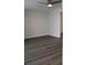 Neutral bedroom with gray laminate flooring and a ceiling fan provides a blank canvas at 7927 Kosi Palm Pl # 201, Tampa, FL 33615