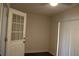 Room with sliding glass doors, neutral walls, and wood laminate flooring at 7927 Kosi Palm Pl # 201, Tampa, FL 33615