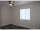 Bedroom with LVP flooring and a window at 7927 Kosi Palm Pl # 201, Tampa, FL 33615