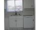 Bright kitchen showcases white cabinets and a stainless dishwasher at 7927 Kosi Palm Pl # 201, Tampa, FL 33615
