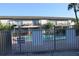 View of community pool and surrounding condominiums on a sunny day at 7927 Kosi Palm Pl # 201, Tampa, FL 33615
