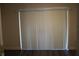 Sliding glass door for deck access with vertical blinds at 7927 Kosi Palm Pl # 201, Tampa, FL 33615