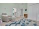 Inviting Bedroom with a comfy rocking chair, a crib, ample light, and connected bathroom for convenience at 795 26Th N Ave, St Petersburg, FL 33704
