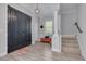 Spacious foyer showcasing a striking front door, staircase, and decorative accents at 795 26Th N Ave, St Petersburg, FL 33704