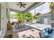 Covered patio with a dining area, ceiling fan, and a view of the pool at 795 26Th N Ave, St Petersburg, FL 33704