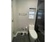Modern bathroom with gray walls, stylish fixtures, and a walk-in shower at 807 E Elm St, Tampa, FL 33604