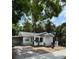 Inviting single-Gathering home with well-kept exterior and a 'For Sale' sign at 807 E Elm St, Tampa, FL 33604