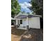 Charming single-story home with a covered front porch and refreshed exterior paint at 807 E Elm St, Tampa, FL 33604