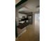 Bright kitchen featuring white cabinets, stainless steel appliances, and an eat-in bar area at 807 E Elm St, Tampa, FL 33604