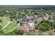 Aerial view of community featuring golf course, pool, tennis courts, and clubhouse at 8135 Golf Club Ct, Hudson, FL 34667