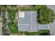 Overhead view of a well maintained home with a spacious yard and mature trees at 8135 Golf Club Ct, Hudson, FL 34667