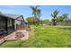 The backyard features a fire pit and is fenced at 8135 Golf Club Ct, Hudson, FL 34667