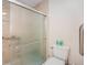 The bathroom features a shower and a commode at 8135 Golf Club Ct, Hudson, FL 34667