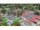 Aerial view of community courts, including tennis, basketball, bocce ball and shuffleboard at 8135 Golf Club Ct, Hudson, FL 34667