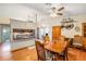 Well lit kitchen and dining area with granite countertops, wooden table, and hardwood floors at 8135 Golf Club Ct, Hudson, FL 34667