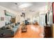 Bright living room with hardwood floors, comfortable seating, and ample natural light at 8135 Golf Club Ct, Hudson, FL 34667