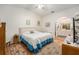 Main bedroom features a ceiling fan, carpet flooring, a closet and an ensuite bathroom at 8135 Golf Club Ct, Hudson, FL 34667