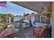 Covered back patio featuring comfortable seating, perfect for outdoor relaxation and entertainment at 8702 Congress St, Port Richey, FL 34668
