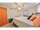 This simple bedroom features a ceiling fan and a view of the house at 8702 Congress St, Port Richey, FL 34668