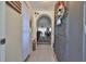 Inviting entryway with tiled flooring, arched doorway, and a glimpse into the living area at 8702 Congress St, Port Richey, FL 34668