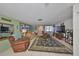 Bright living space with tile flooring, cozy seating, and a view of the connecting rooms at 8702 Congress St, Port Richey, FL 34668