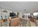Inviting living room with comfortable seating, a large television, and tile flooring at 8702 Congress St, Port Richey, FL 34668