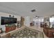 Spacious living room featuring tile floors and comfortable seating, perfect for Gathering gatherings at 8702 Congress St, Port Richey, FL 34668