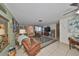 Spacious living area featuring tile floors, comfortable seating, and an open layout at 8702 Congress St, Port Richey, FL 34668
