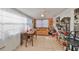 Bright and airy sunroom/living room with tiled floor, comfortable seating, and abundant light at 8702 Congress St, Port Richey, FL 34668