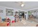 Bright living room featuring tile floors and natural light streaming through sliding glass doors at 8702 Congress St, Port Richey, FL 34668