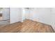 Bedroom with wood-look floors and closet at 8744 Andros Ln, Port Richey, FL 34668