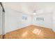 Bedroom featuring a mirrored closet and wood flooring at 8744 Andros Ln, Port Richey, FL 34668