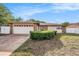 Charming single-story home boasts stone accents, a two-car garage, and a well-manicured front yard at 8744 Andros Ln, Port Richey, FL 34668