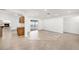 Open-concept living area showcasing wood flooring and tile flooring with sliding glass doors at 8744 Andros Ln, Port Richey, FL 34668