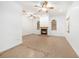 Spacious living room with a fireplace and tile flooring with decorative border at 8744 Andros Ln, Port Richey, FL 34668