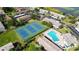 Aerial view of community featuring a swimming pool and tennis courts at 9209 Seminole Blvd # 156, Seminole, FL 33772