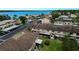 View of condo units featuring covered parking, green space, and private patios at 9209 Seminole Blvd # 156, Seminole, FL 33772