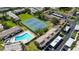 Aerial shot of community with tennis courts and swimming pool at 9209 Seminole Blvd # 156, Seminole, FL 33772