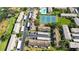 Aerial view of condo community with pool, tennis courts, and covered parking at 9209 Seminole Blvd # 156, Seminole, FL 33772
