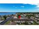 Scenic aerial view of townhomes with a lake and blue sky in the background at 9209 Seminole Blvd # 156, Seminole, FL 33772