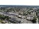 Aerial view of neighborhood and commercial area with mature trees at 9209 Seminole Blvd # 156, Seminole, FL 33772