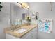 Elegant bathroom with granite countertops, dual sinks, decorative towels and a large mirror for added style at 9209 Seminole Blvd # 156, Seminole, FL 33772