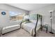 Bedroom with a bunk bed by a window and a storage bench at 9209 Seminole Blvd # 156, Seminole, FL 33772