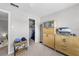 Bedroom with neutral walls, a storage cabinet, and access to an organized closet at 9209 Seminole Blvd # 156, Seminole, FL 33772