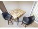 Close-up of dining area with unique table top and comfortable seating at 9209 Seminole Blvd # 156, Seminole, FL 33772