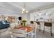 Charming dining area open to the kitchen and living room, perfect for entertaining guests at 9209 Seminole Blvd # 156, Seminole, FL 33772