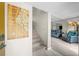 Inviting entryway with stairs and an open living space with modern decor and neutral colors at 9209 Seminole Blvd # 156, Seminole, FL 33772