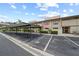 Exterior view of a condo featuring ample parking and a well-maintained facade enhancing curb appeal at 9209 Seminole Blvd # 156, Seminole, FL 33772