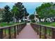 Scenic view of wooden boardwalk and well-maintained landscaping enhancing the property's curb appeal at 9209 Seminole Blvd # 156, Seminole, FL 33772