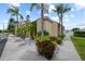 Exterior view of a building with lush landscaping enhancing the property's curb appeal at 9209 Seminole Blvd # 156, Seminole, FL 33772